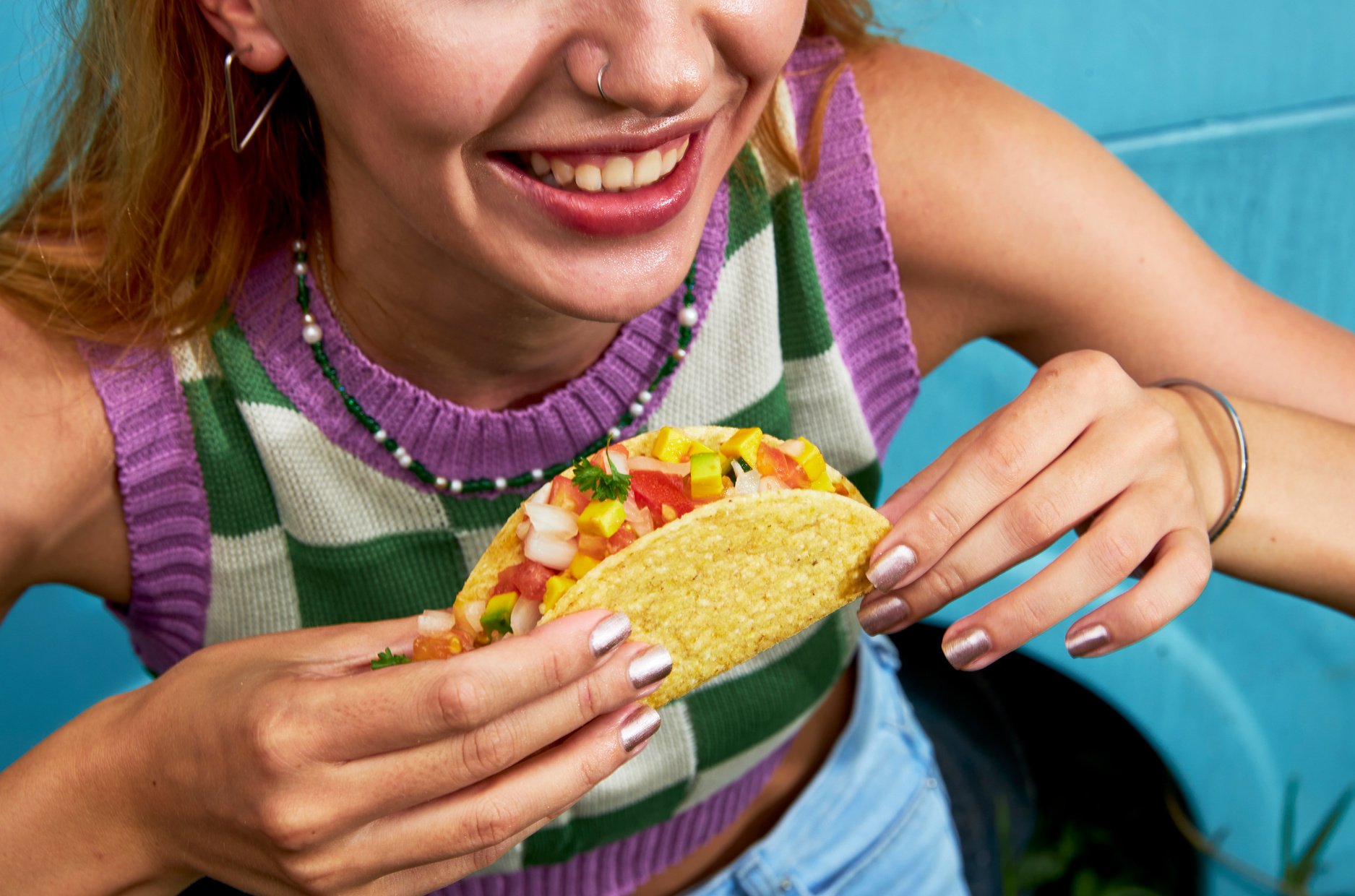 Woman Enjoying Plant-Based Taco