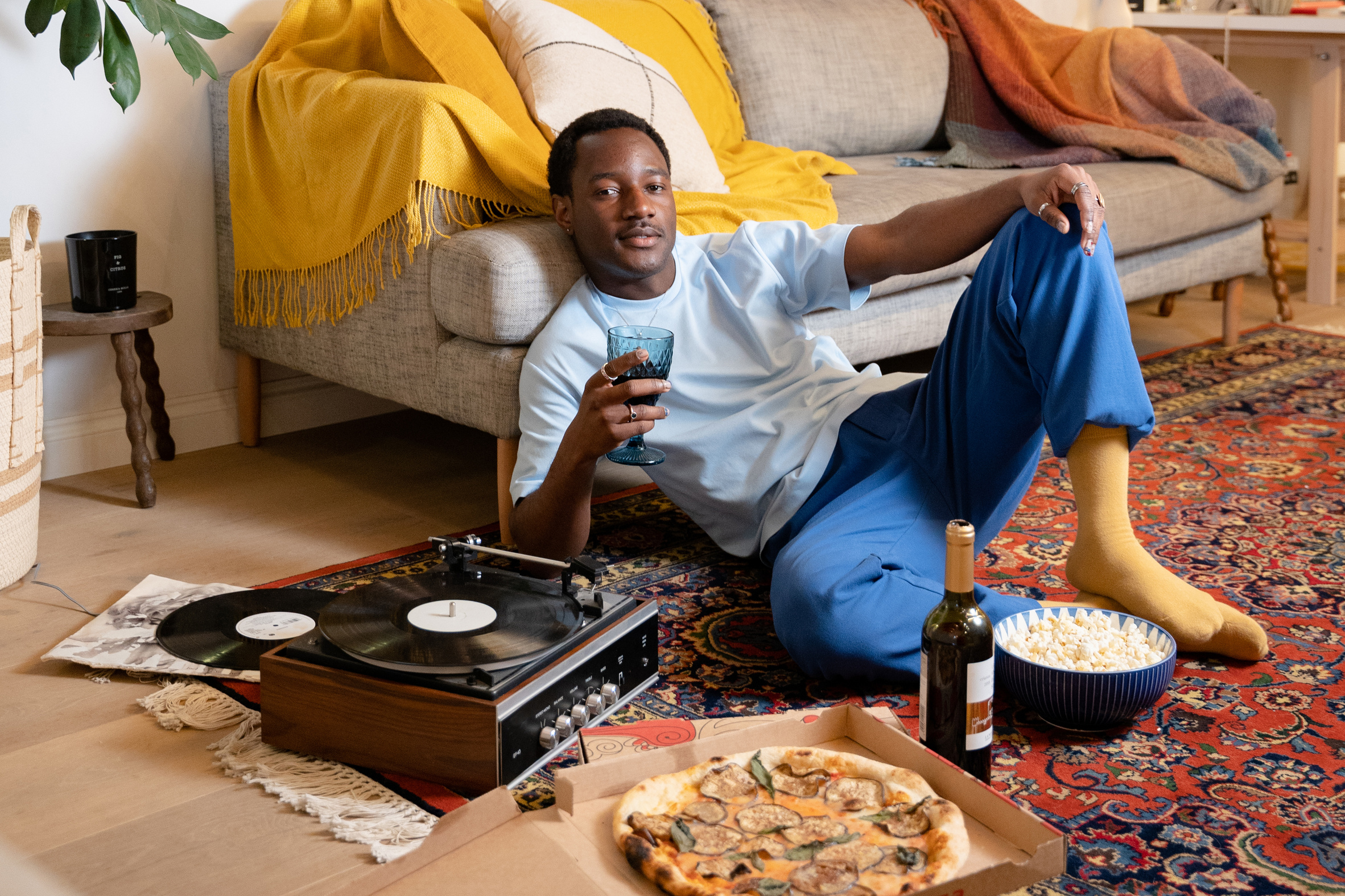 Editorial People & Spaces Man Having Pizza on Living Room